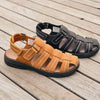 Group picture of two Hunter sandals side-by-side on dock from angled top down view