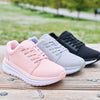 All 3 Ultima X Athletic Shoes in different color options available side-by-side (Black, Grey, & Pink) on wooden surface outside