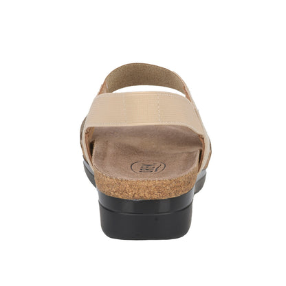 Beige sandal with cork sole on a white background