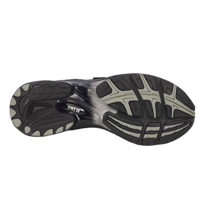 Close-up of a black and gray athletic shoe sole on a white background