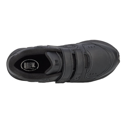 Black shoe with velcro straps on a white background