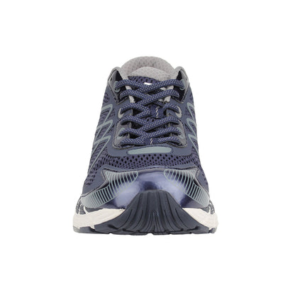 Navy running shoe with white sole on a white background