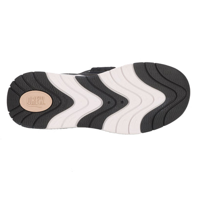 Close-up of a shoe sole with a brand logo on a white background