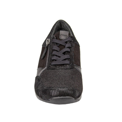 Black shoe with a textured sole on a white background