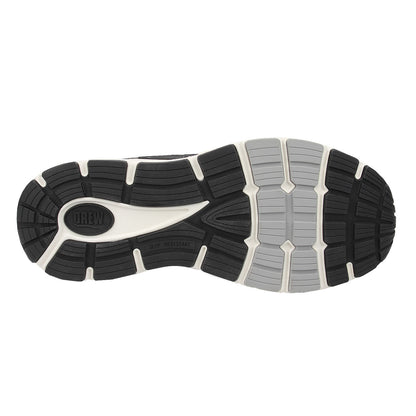 Close-up of a running shoe sole with brand logo on a white background