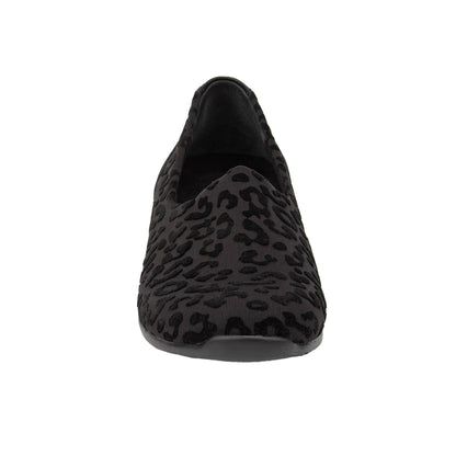Black loafer with leopard print pattern on a white background