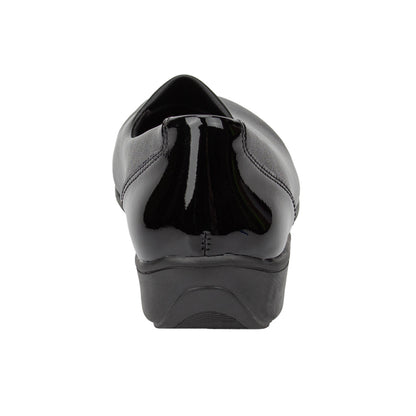 Black patent leather shoe on a white background