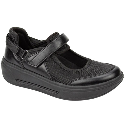 A single black women's wedge shoe with a hook-and-loop strap closure, featuring a mix of smooth and textured synthetic materials, shown on a white background.