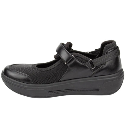 A black women's Mary Jane-style platform shoe with a hook-and-loop strap closure, shown in a side profile view against a plain white background.