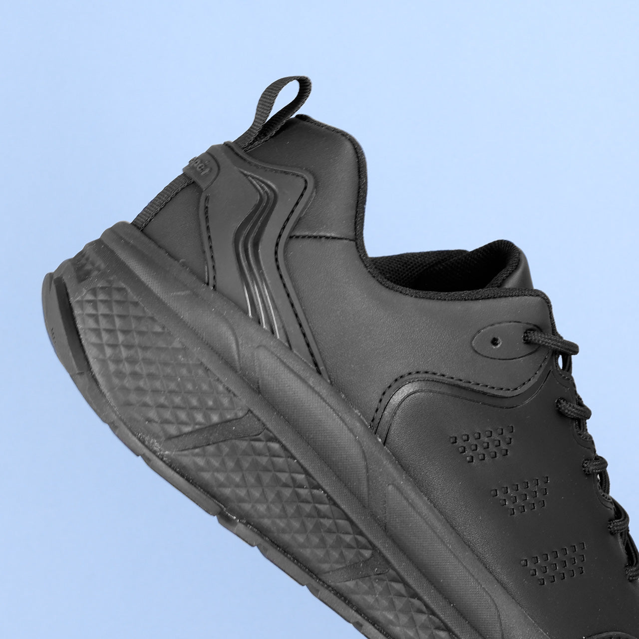 Propet Men's Ultra Leather Sneaker Black Sneaker with laces Close up heel view