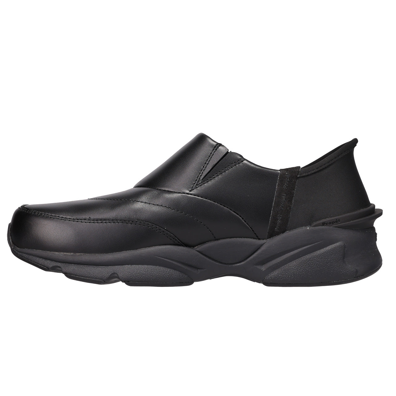 A single black slip-on work shoe with a chunky, sculpted sole, shown in a side profile on a plain white background.