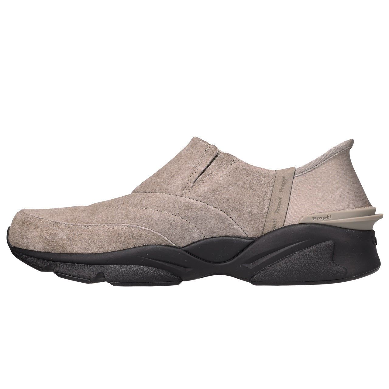 A single slip-on shoe in taupe suede with a chunky black sole, shown from a side profile view against a plain white background.