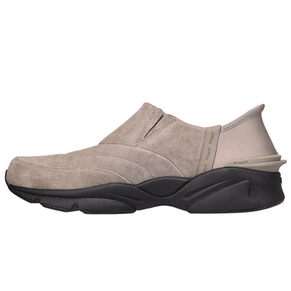 A single slip-on shoe in taupe suede with a chunky black sole, shown from a side profile view against a plain white background.