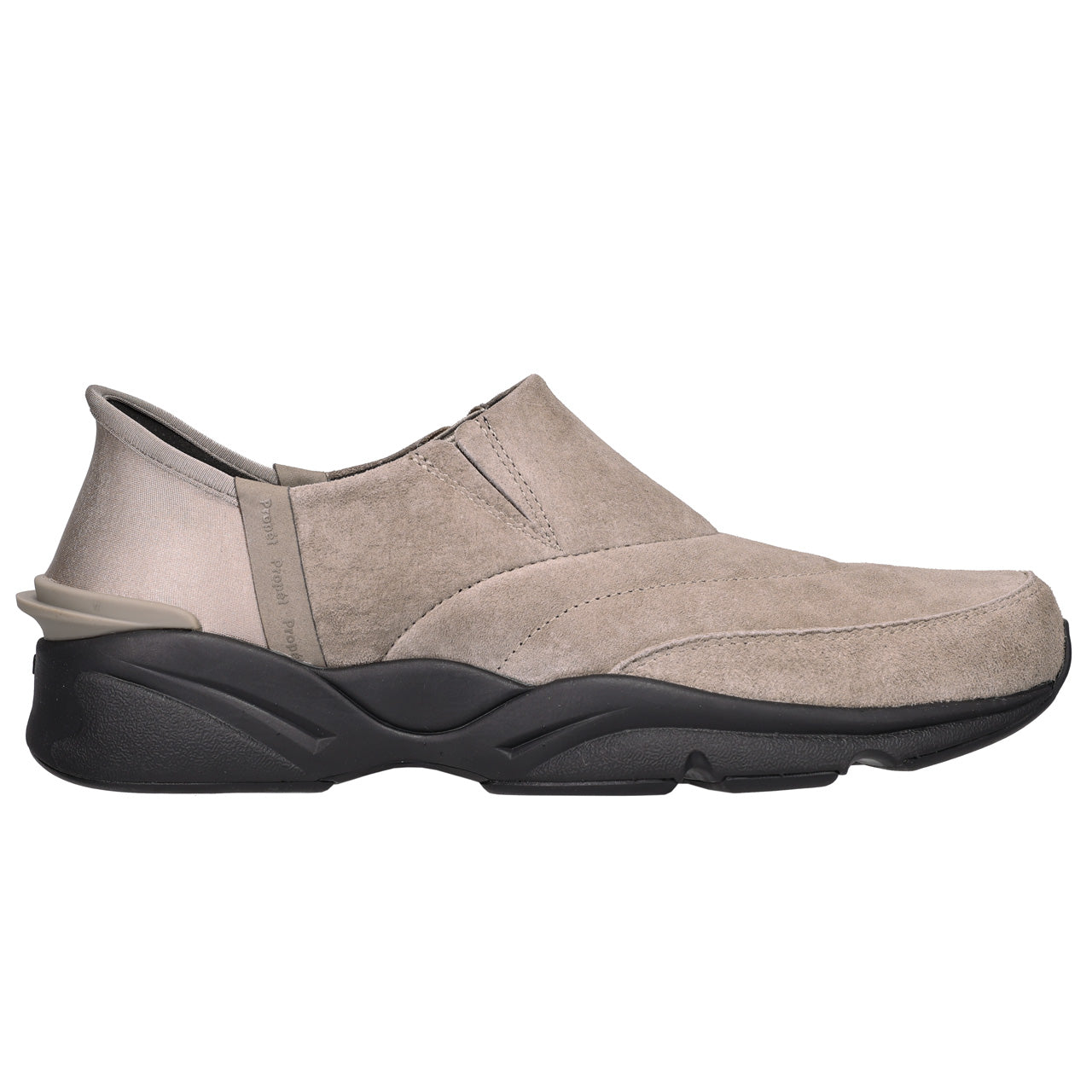 A single slip-on wedge shoe in taupe suede with a chunky black sole, shown from a side profile view against a plain white background.