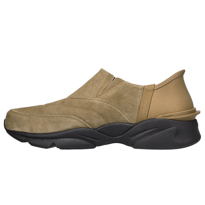 A slip-on casual shoe in tan suede and beige leather with a chunky black sole, shown from a side profile on a white background.