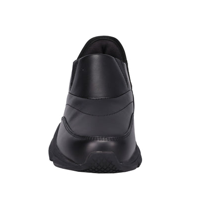 A black slip-on shoe shown from a rear three-quarter view against a plain white background.