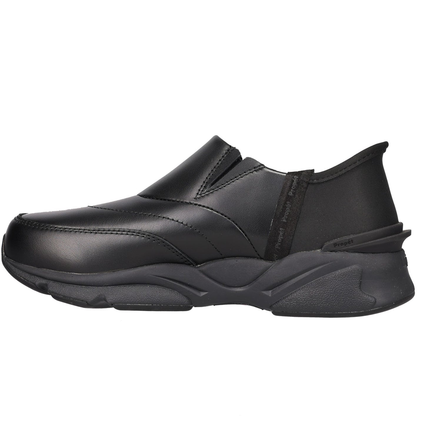 A black slip-on sneaker with a textured, chunky sole, shown in a side profile view against a plain white background.