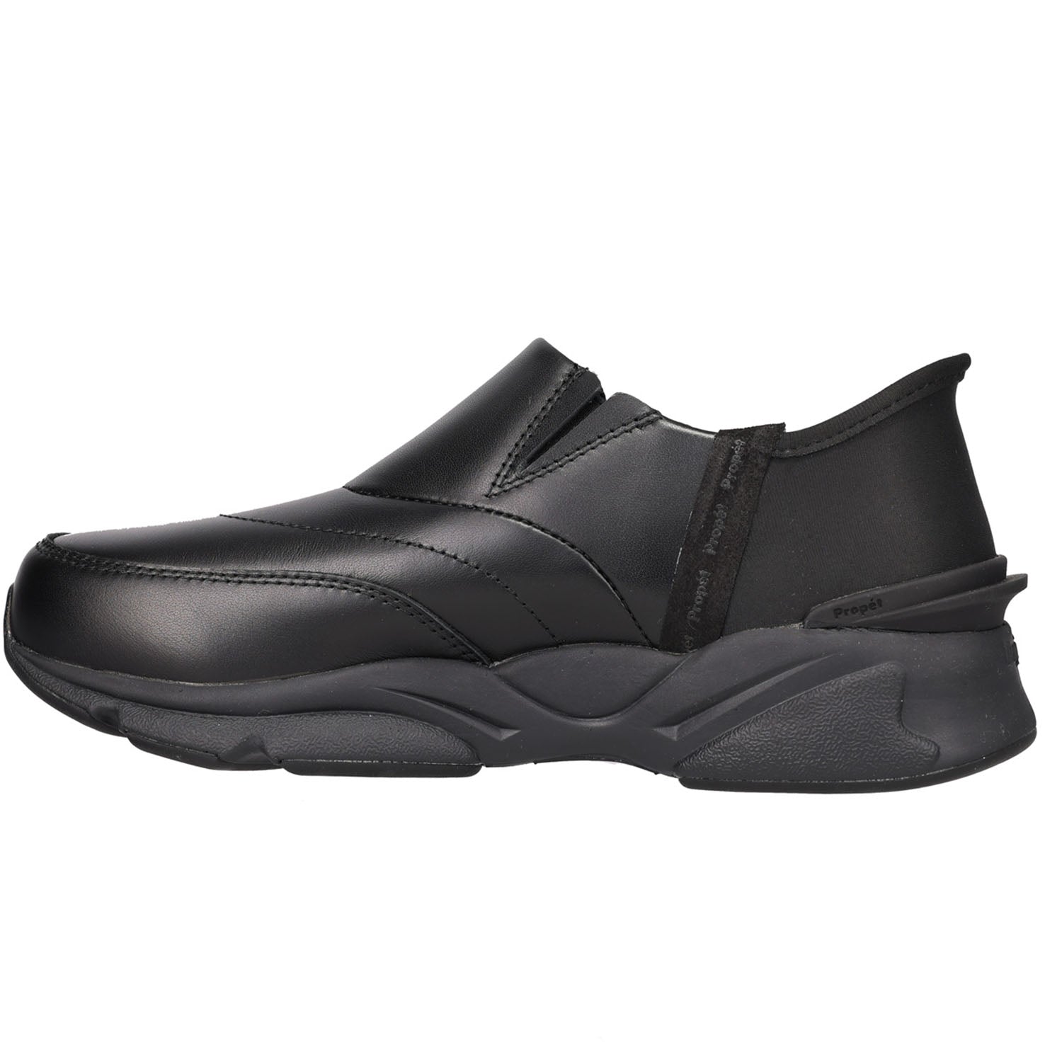 A black slip-on sneaker with a textured, chunky sole, shown in a side profile view against a plain white background.