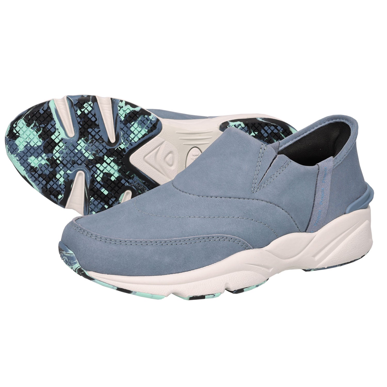 A pair of slip-on athletic sneakers in a dusty slate blue color, with one shoe showing the side profile and the other showing the patterned outsole.