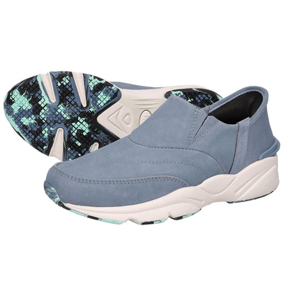 A pair of slip-on athletic sneakers in a dusty slate blue color, with one shoe showing the side profile and the other showing the patterned outsole.