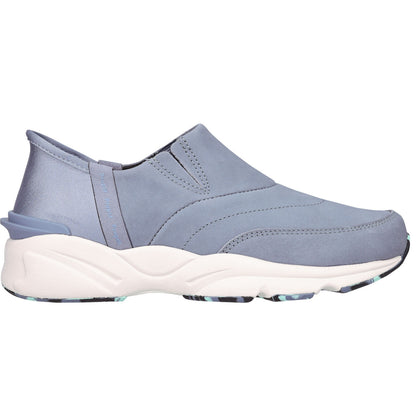 A light blue slip-on sneaker with a thick white midsole and a patterned outsole, shown from a side profile view on a white background.