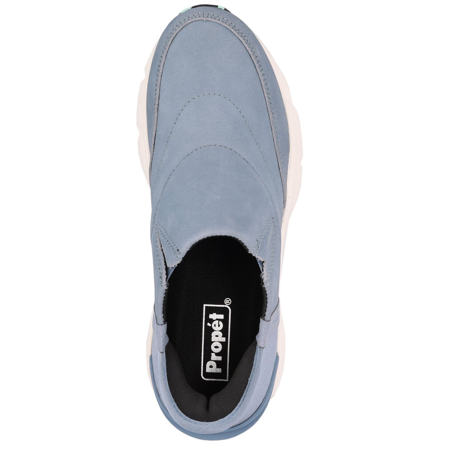 A single Propét slip-on sneaker shown from a top-down view against a plain white background. The shoe features a dusty blue suede upper, a black interior lining, and a thick white midsole.