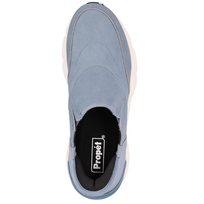 A single Propét slip-on sneaker shown from a top-down view against a plain white background. The shoe features a dusty blue suede upper, a black interior lining, and a thick white midsole.