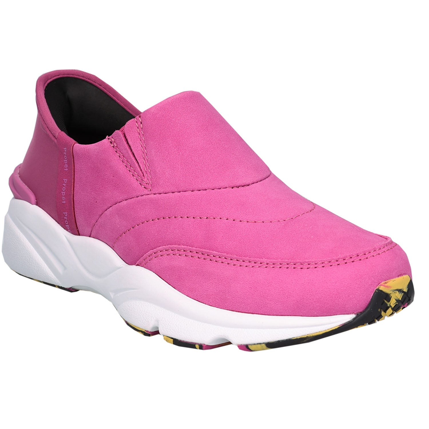 A pink slip-on sneaker with a thick white midsole and a small yellow and black patterned accent on the toe, shown against a plain white background.