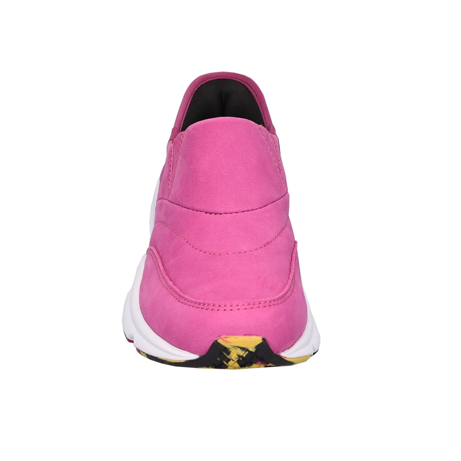A single pink slip-on sneaker shown from the back, featuring a pink suede-like upper, a white midsole, and a black and yellow patterned outsole.