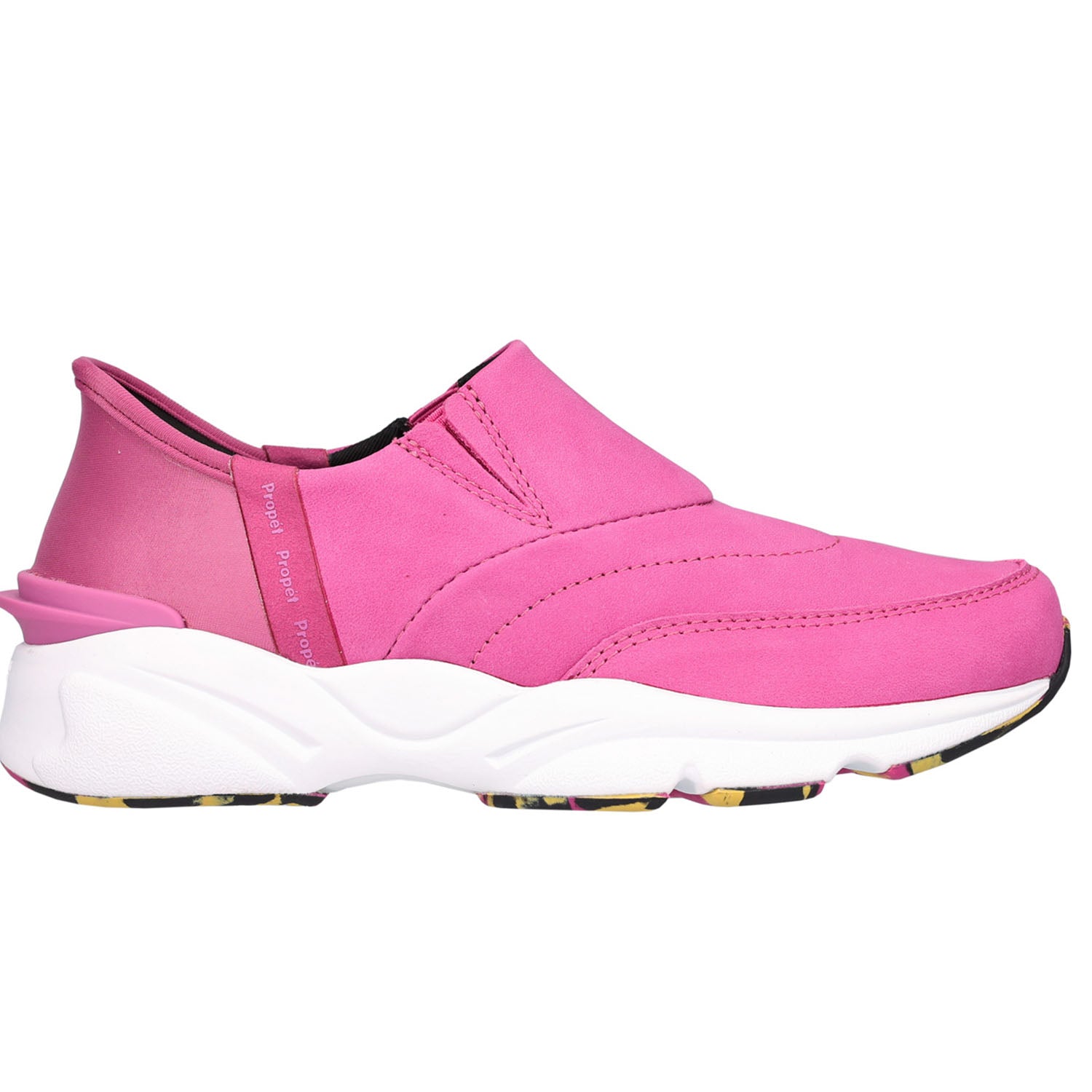 A pink slip-on sneaker with a chunky white sole and a small multicolor patterned outsole, shown from a side profile on a white background.