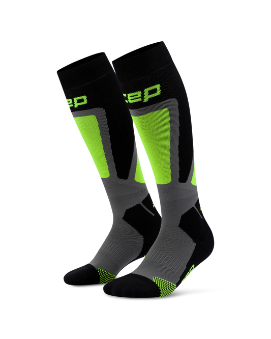 CEP Men's Ski Thermo Tall Socks - A pair of knee-high athletic socks in black, gray, and neon green, shown against a plain white background. The brand name 'CEP' is partially visible in neon green on the upper calf.