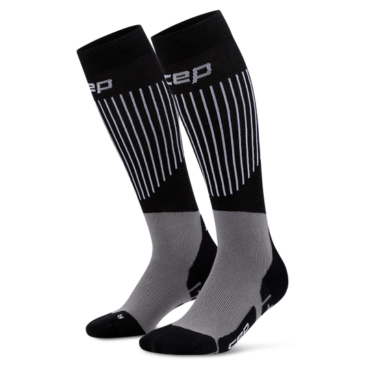 CEP Women's Ski Ultralight Tall Socks - Pair of black and gray compression socks with 'CEP' branding on a white background