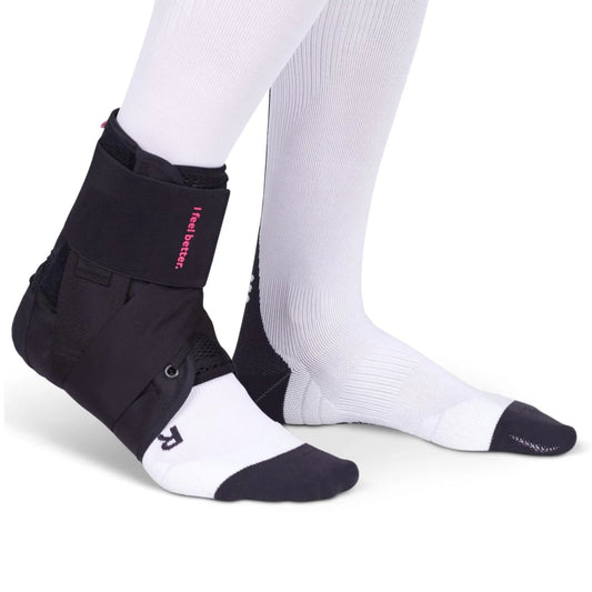 DocOrtho Swift Lace Ankle Support - DocOrtho Swift Lace ankle support brace worn with white socks on a white background